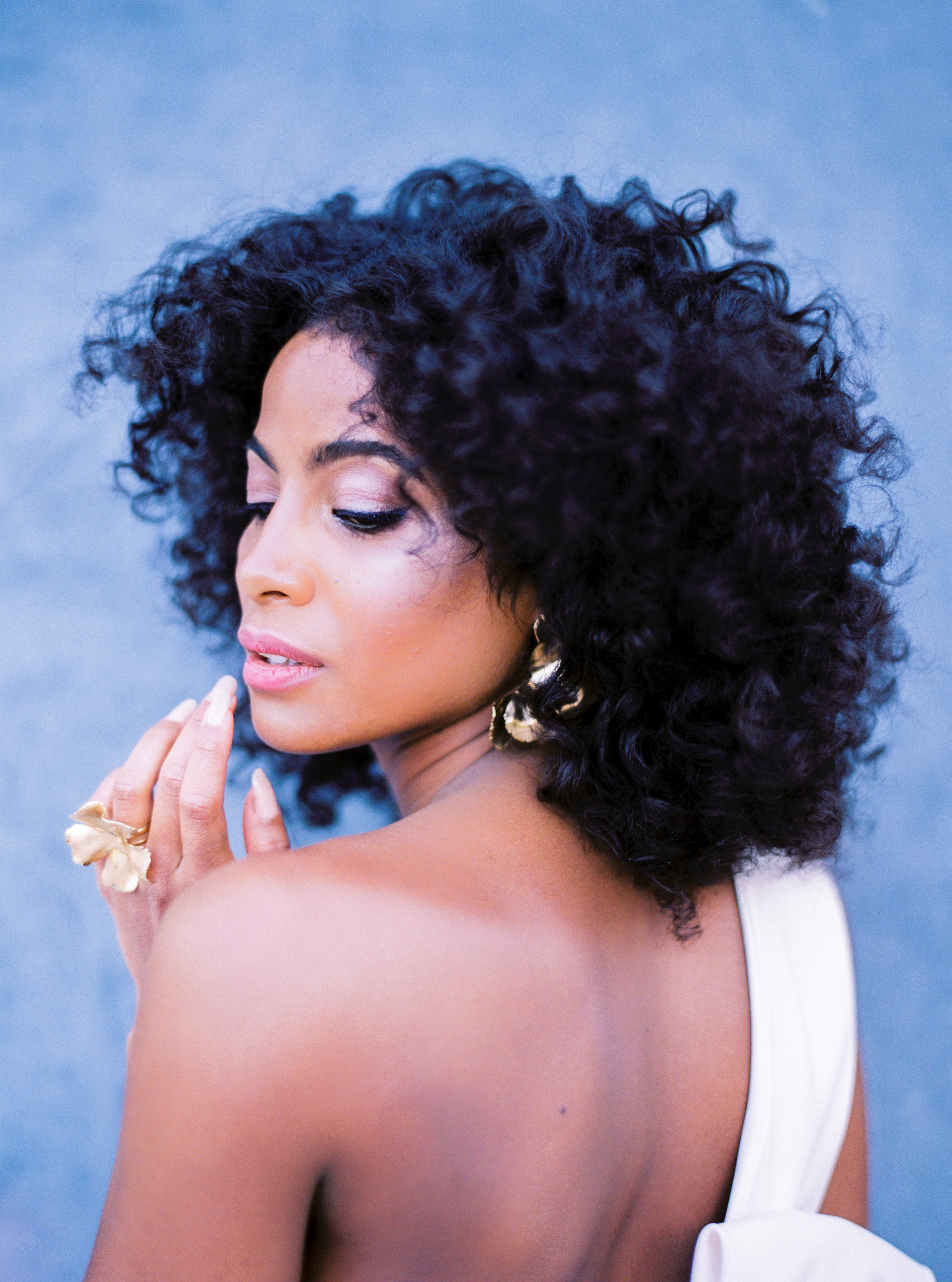 Elegant hair styling with curls and gold accessories by Ciara Coiffure